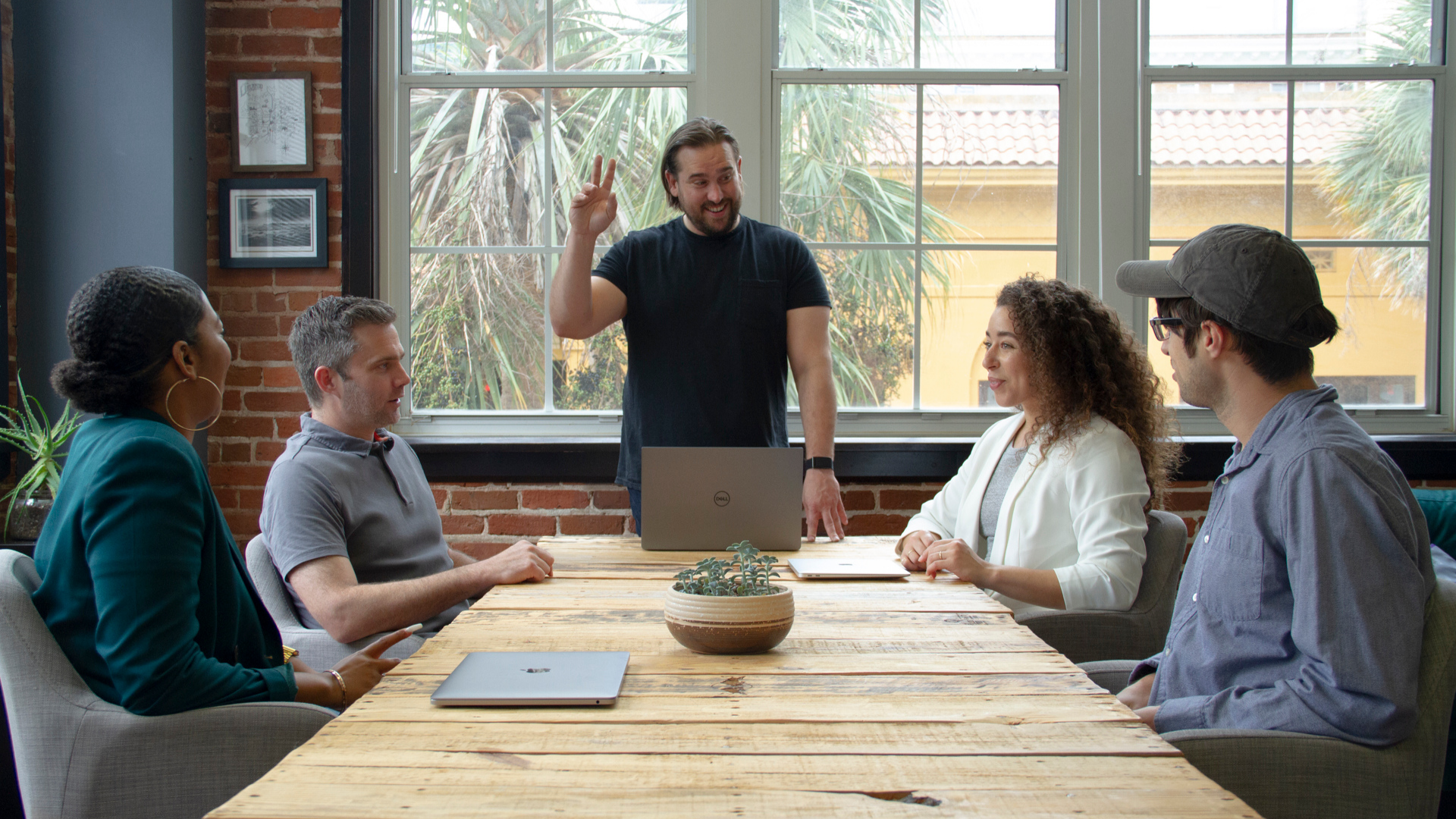 Growth team members and founder Chris Nault around the conference table at the Growth Marketing Firm headquarters in Orlando, Florida.