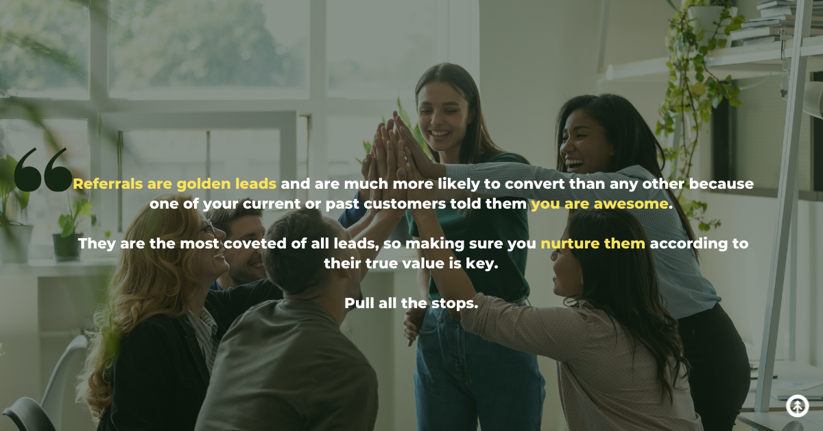 A sales team celebrating a referral in an office setting with a quote from Growth Marketing Firm about how to handle referral leads. 