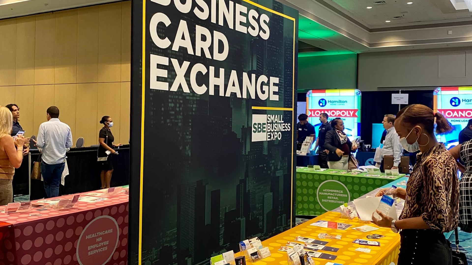 A visitor views the display of business cards at the Small Business Expo trade show in Orlando, Florida