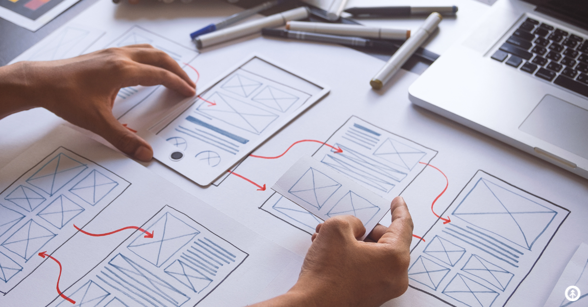 A UX designer creating a blueprint for the user experience of a website for mobile users. 